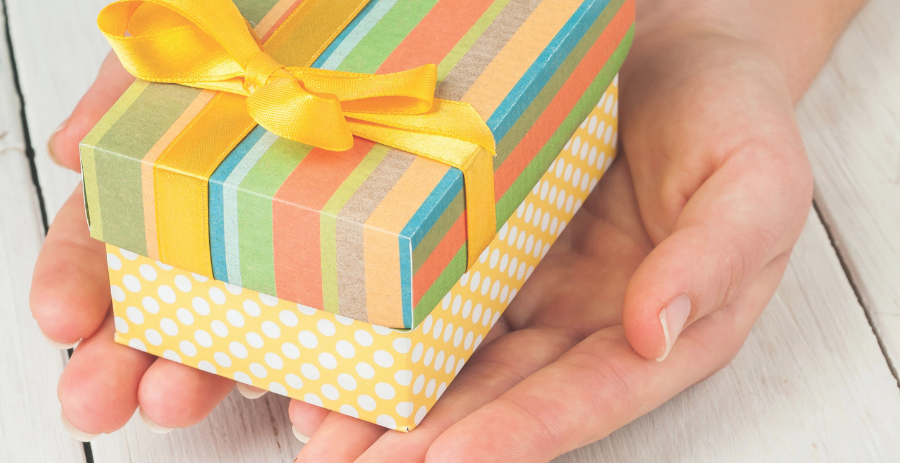 small gift box in palm of hands